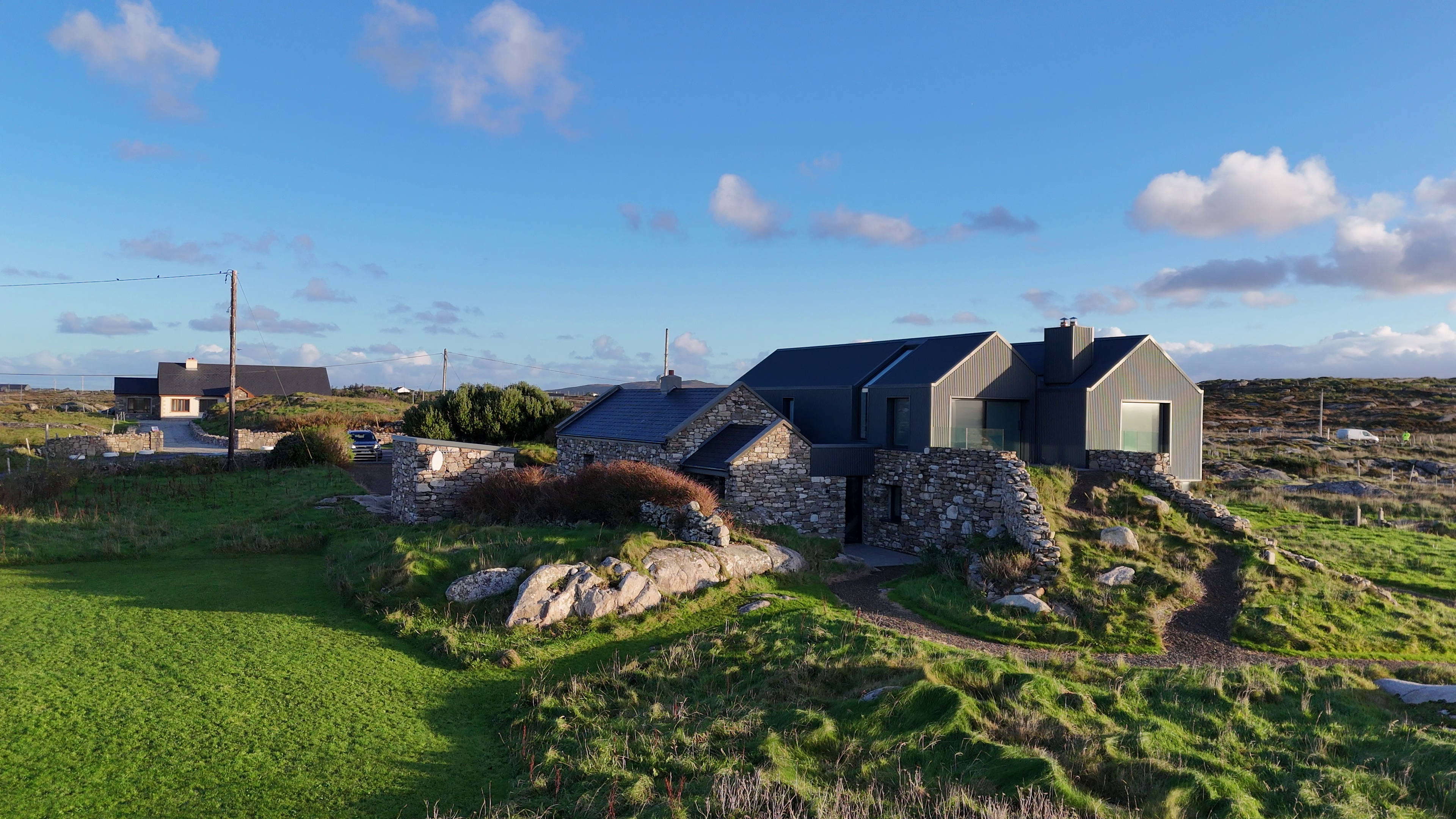 Left side elevation of cottage, this image has the old cottage in the foreground