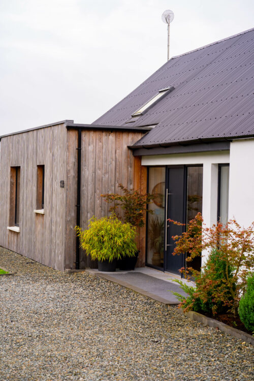 Front elevation showing the front door and additional accomodation