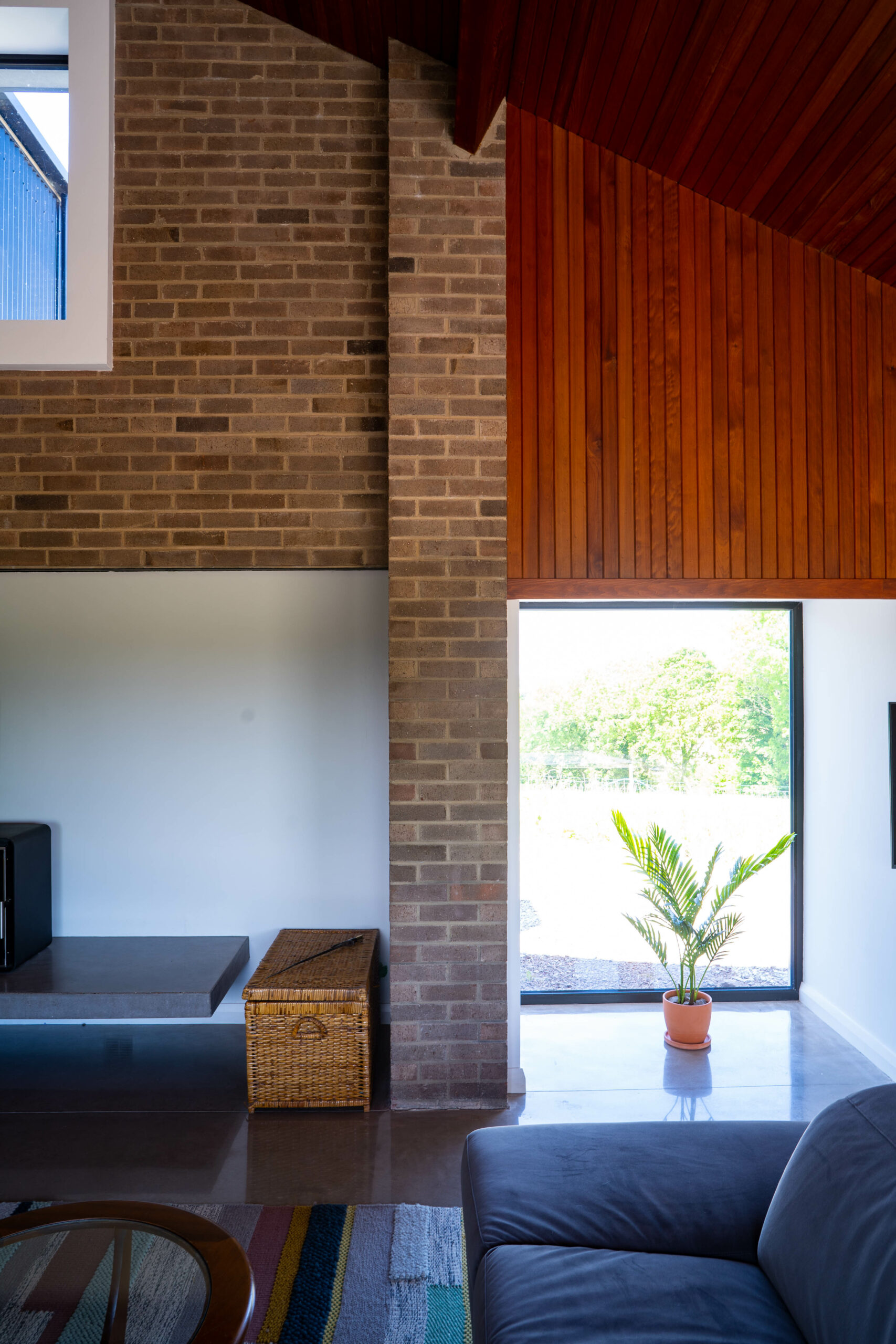 The contrasting materials of brick and wood used internally