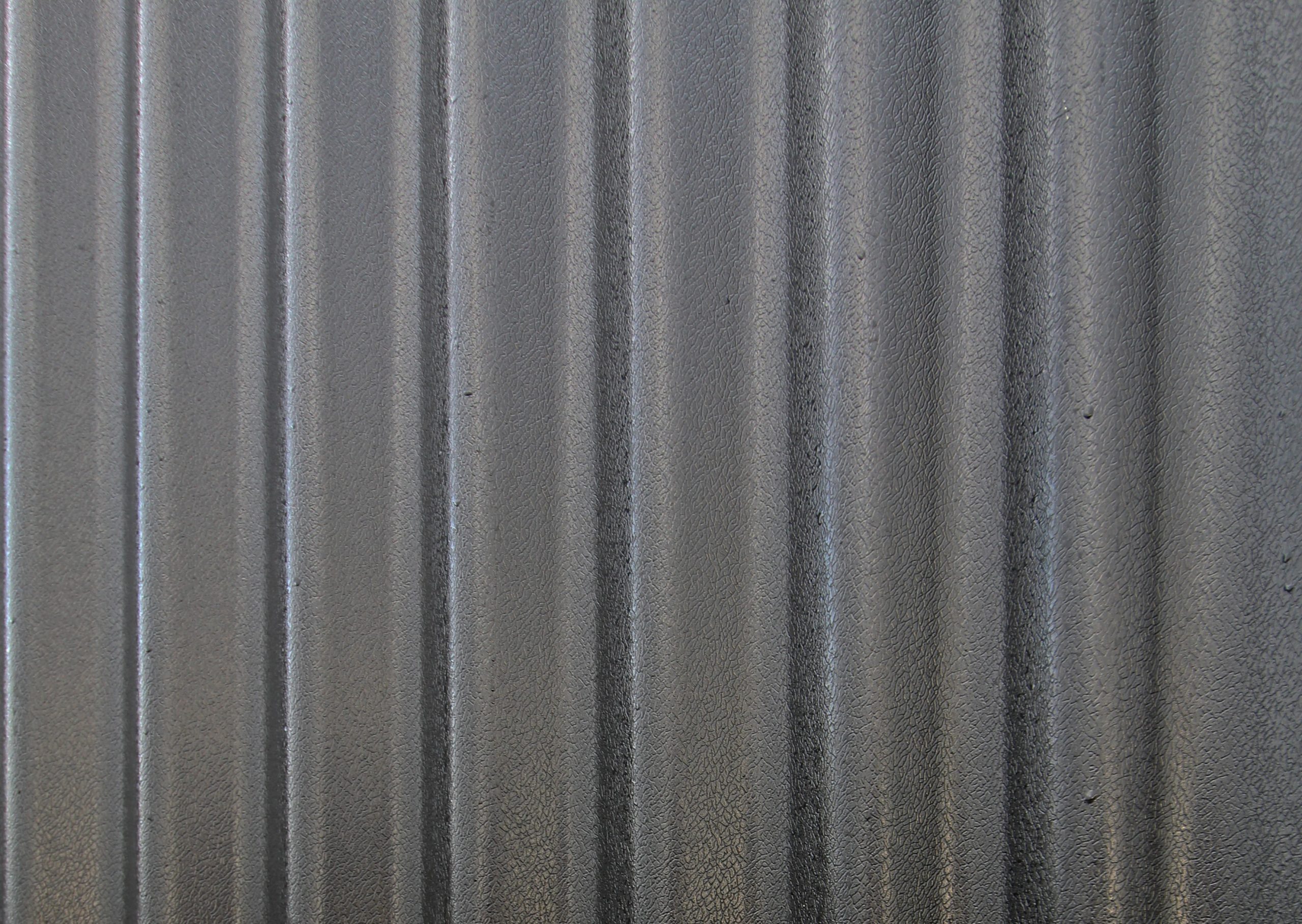 Close up of black corrugated metal cladding